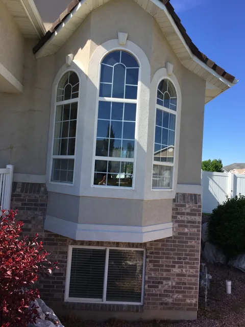 Tall arched windows on a home exterior